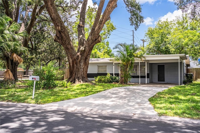 1604 Park Dr, Lakeland, FL 33803 - single story home featuring concrete driveway and an attached carport