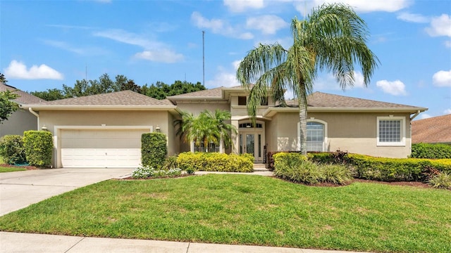 6757 High Grove Dr, Lakeland, FL 33813 - view of front of property with stucco siding, concrete driveway, a garage, and a front yard