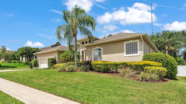 6757 High Grove Dr, Lakeland, FL 33813 - view of front of home with stucco siding, an attached garage, and a front yard