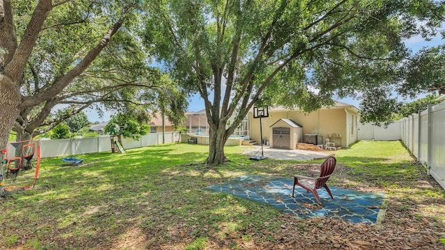 6757 High Grove Dr, Lakeland, FL 33813 - fenced backyard featuring a storage shed, a patio, and a playground
