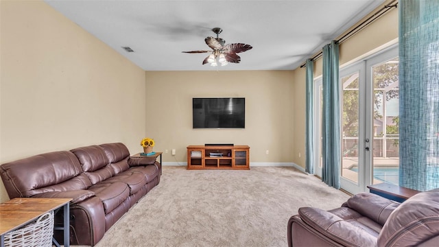 6757 High Grove Dr, Lakeland, FL 33813 - carpeted living area with ceiling fan and french doors