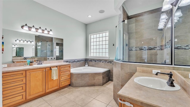 6757 High Grove Dr, Lakeland, FL 33813 - bathroom featuring a bath, a stall shower, and two vanities