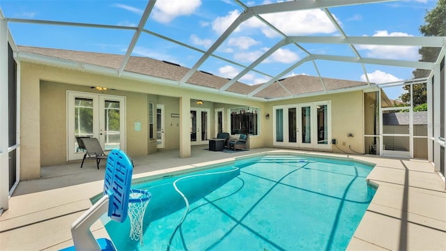 6757 High Grove Dr, Lakeland, FL 33813 - swimming pool with french doors, a patio, and glass enclosure