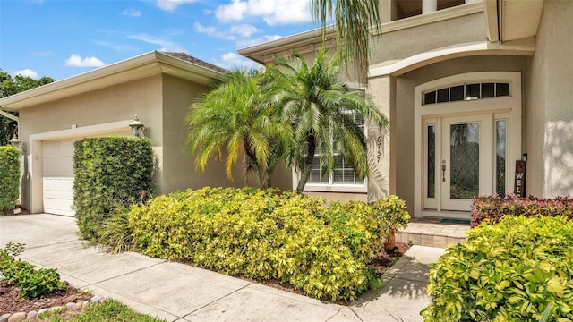 6757 High Grove Dr, Lakeland, FL 33813 - entrance to property with stucco siding, a garage, and concrete driveway