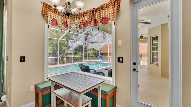 6757 High Grove Dr, Lakeland, FL 33813 - dining room with plenty of natural light, a chandelier, and a textured wall
