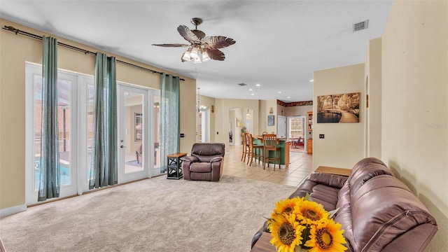 6757 High Grove Dr, Lakeland, FL 33813 - tiled living room with carpet flooring, ceiling fan, and recessed lighting