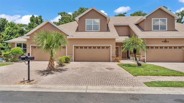6365 Torrington Cir, Lakeland, FL 33811 - multi unit property with stucco siding, roof with shingles, driveway, and stone siding