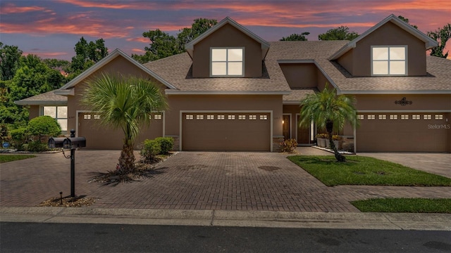 6365 Torrington Cir, Lakeland, FL 33811 - view of front of house featuring driveway, stucco siding, and roof with shingles