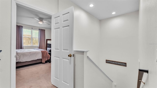 6365 Torrington Cir, Lakeland, FL 33811 - hall with an upstairs landing, light carpet, and recessed lighting