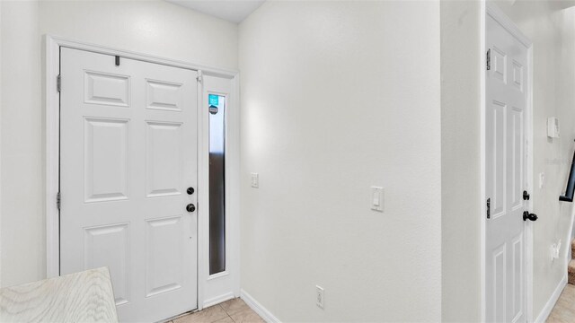 6365 Torrington Cir, Lakeland, FL 33811 - entryway featuring light tile patterned floors and baseboards