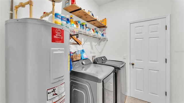 6365 Torrington Cir, Lakeland, FL 33811 - washroom with water heater, washer and dryer, and light tile patterned floors