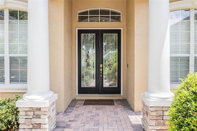 2026 Indian Sky Cir, Lakeland, FL 33813 - doorway to property with french doors and stucco siding