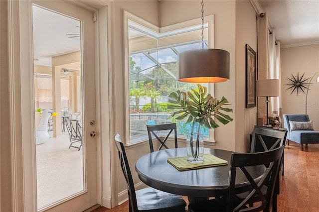 2026 Indian Sky Cir, Lakeland, FL 33813 - dining space featuring wood finished floors and crown molding
