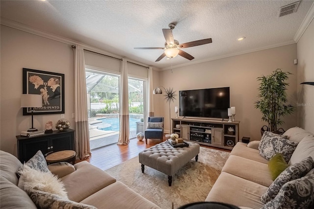 2026 Indian Sky Cir, Lakeland, FL 33813 - living area with a ceiling fan, wood finished floors, crown molding, and a textured ceiling