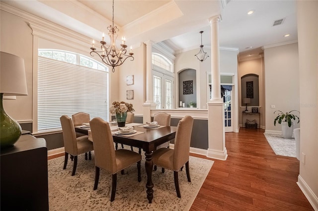 2026 Indian Sky Cir, Lakeland, FL 33813 - dining space with ornate columns, wood finished floors, a chandelier, ornamental molding, and recessed lighting