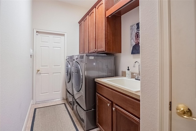 2026 Indian Sky Cir, Lakeland, FL 33813 - laundry area featuring independent washer and dryer, cabinet space, and light tile patterned flooring