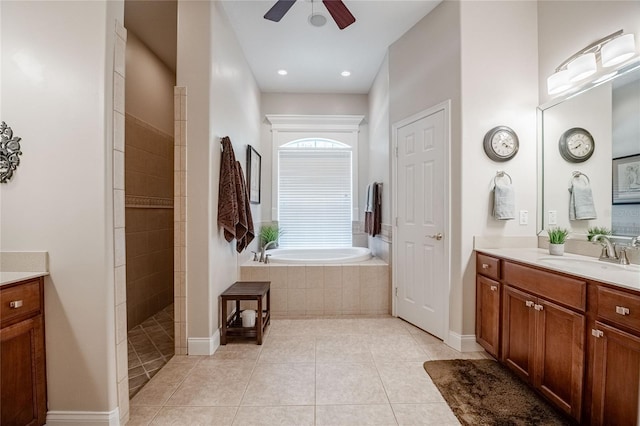 2026 Indian Sky Cir, Lakeland, FL 33813 - bathroom featuring a garden tub, vanity, ceiling fan, tile patterned flooring, and a walk in shower
