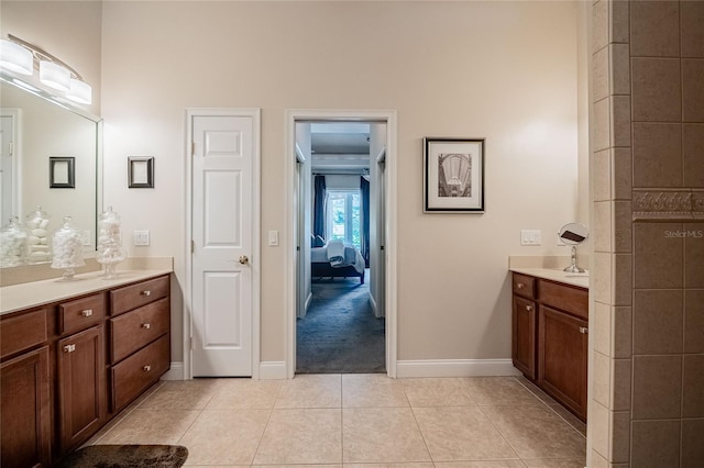 2026 Indian Sky Cir, Lakeland, FL 33813 - ensuite bathroom featuring vanity, a high ceiling, and tile patterned floors