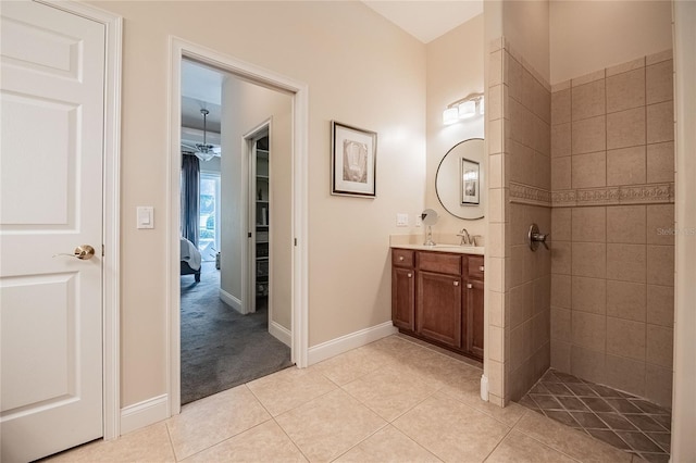 2026 Indian Sky Cir, Lakeland, FL 33813 - bathroom featuring vanity, tile patterned floors, ensuite bath, and a tile shower