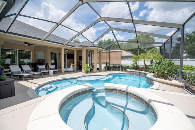 2026 Indian Sky Cir, Lakeland, FL 33813 - view of pool featuring ceiling fan, a pool with connected hot tub, a patio area, and glass enclosure