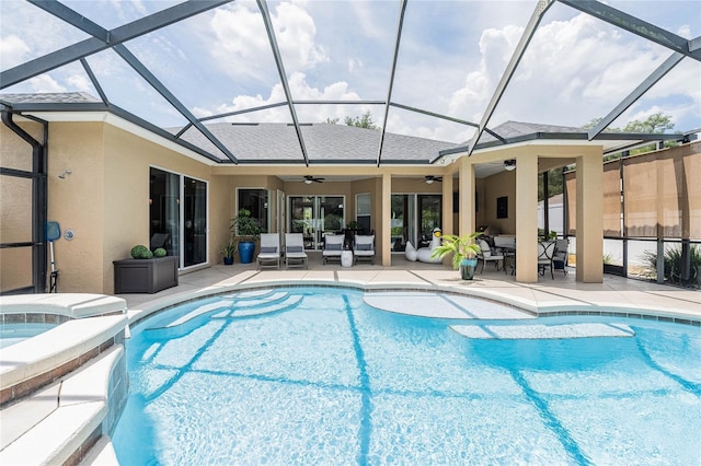 2026 Indian Sky Cir, Lakeland, FL 33813 - view of swimming pool with ceiling fan, a patio, a pool with connected hot tub, a lanai, and outdoor dining area