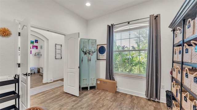 1028 15th St NE, Winter Haven, FL 33881 - bedroom with wood finished floors, multiple windows, and recessed lighting