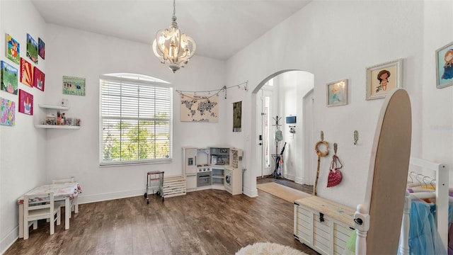 1028 15th St NE, Winter Haven, FL 33881 - miscellaneous room with arched walkways, a chandelier, and wood finished floors
