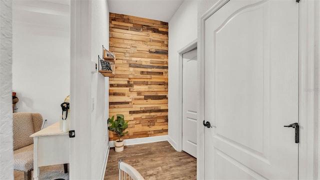 1028 15th St NE, Winter Haven, FL 33881 - corridor with wooden walls and wood finished floors
