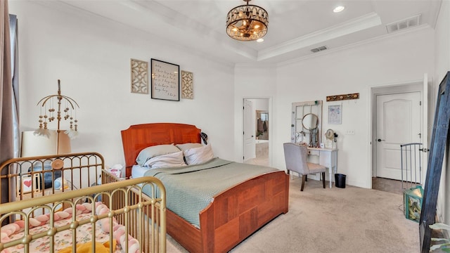 1028 15th St NE, Winter Haven, FL 33881 - carpeted bedroom with a chandelier, crown molding, recessed lighting, a tray ceiling, and ensuite bathroom