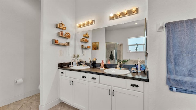 1028 15th St NE, Winter Haven, FL 33881 - bathroom featuring double vanity, tile patterned floors, and a shower stall