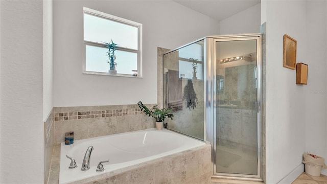 1028 15th St NE, Winter Haven, FL 33881 - full bathroom featuring a shower stall and a garden tub