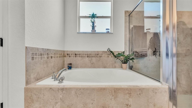 1028 15th St NE, Winter Haven, FL 33881 - full bath featuring a garden tub and a shower stall