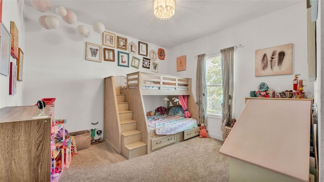 1028 15th St NE, Winter Haven, FL 33881 - carpeted bedroom featuring a chandelier