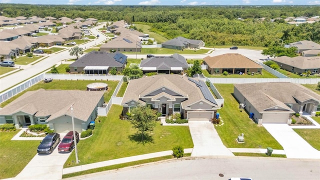 1028 15th St NE, Winter Haven, FL 33881 - aerial perspective of suburban area with a forest