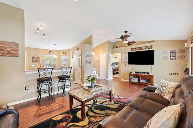 1420 Meadows Pond Dr, Bartow, FL 33830 - living room with a ceiling fan, wood finished floors, and vaulted ceiling