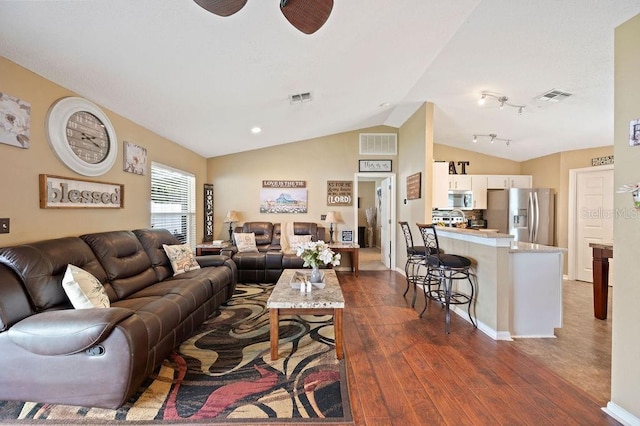 1420 Meadows Pond Dr, Bartow, FL 33830 - living area with dark wood-type flooring and lofted ceiling
