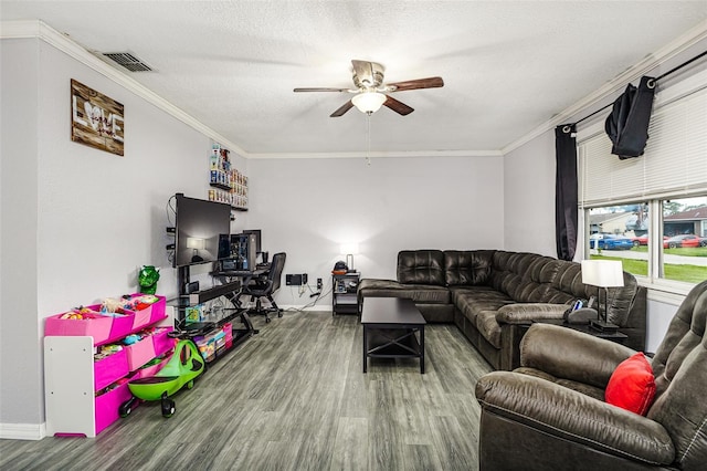 2443 Delrose Dr E, Lakeland, FL 33805 - living room featuring ceiling fan, wood finished floors, and crown molding