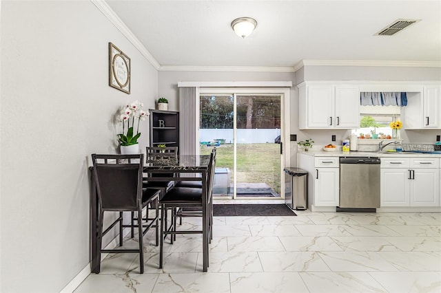 2443 Delrose Dr E, Lakeland, FL 33805 - kitchen featuring stainless steel dishwasher, light marble finish floors, white cabinetry, crown molding, and light countertops