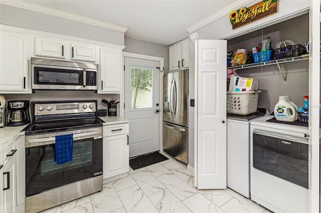 2443 Delrose Dr E, Lakeland, FL 33805 - kitchen with appliances with stainless steel finishes, separate washer and dryer, light marble finish floors, white cabinets, and crown molding