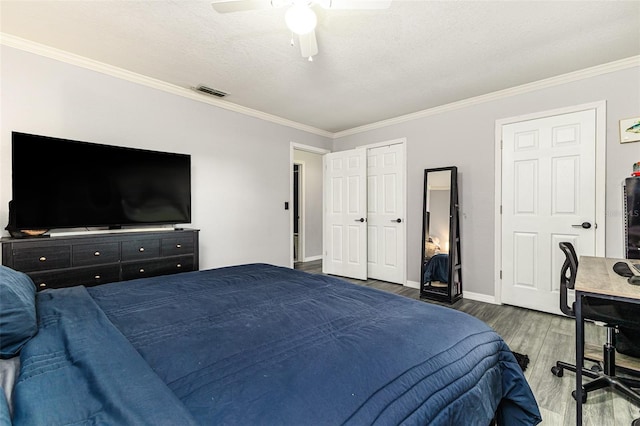 2443 Delrose Dr E, Lakeland, FL 33805 - bedroom featuring wood finished floors, ornamental molding, and a ceiling fan