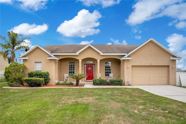 5370 Knights Station Rd, Lakeland, FL 33810 - view of front of home with stucco siding, concrete driveway, a garage, a front yard, and a porch