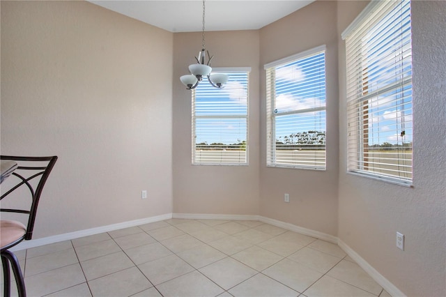 5370 Knights Station Rd, Lakeland, FL 33810 - unfurnished dining area with a chandelier and light tile patterned flooring
