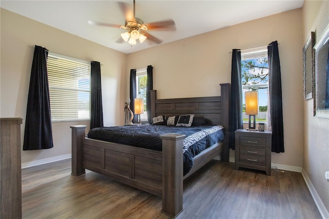 5370 Knights Station Rd, Lakeland, FL 33810 - bedroom with dark wood-style flooring and a ceiling fan