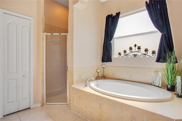 5370 Knights Station Rd, Lakeland, FL 33810 - bathroom featuring a bath, a stall shower, a closet, and tile patterned floors