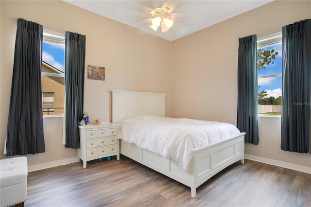 5370 Knights Station Rd, Lakeland, FL 33810 - bedroom with wood finished floors and a ceiling fan