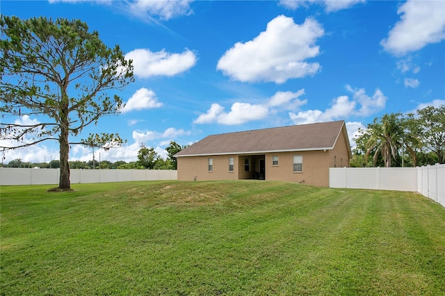 5370 Knights Station Rd, Lakeland, FL 33810 - back of house with stucco siding and a fenced backyard