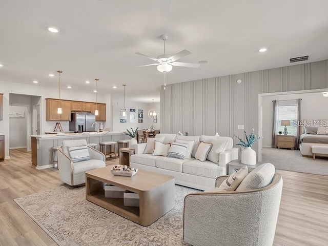 7515 SW 107th Ln, Ocala, FL 34476 - living room with ceiling fan, light wood-style floors, and recessed lighting