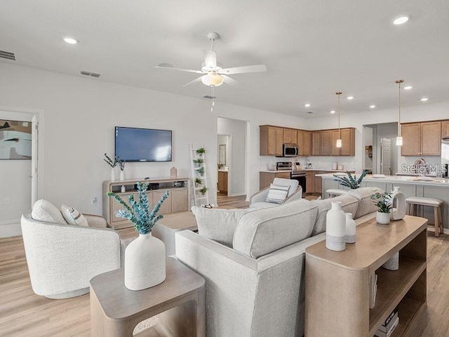 7515 SW 107th Ln, Ocala, FL 34476 - living area with light wood finished floors, ceiling fan, and recessed lighting