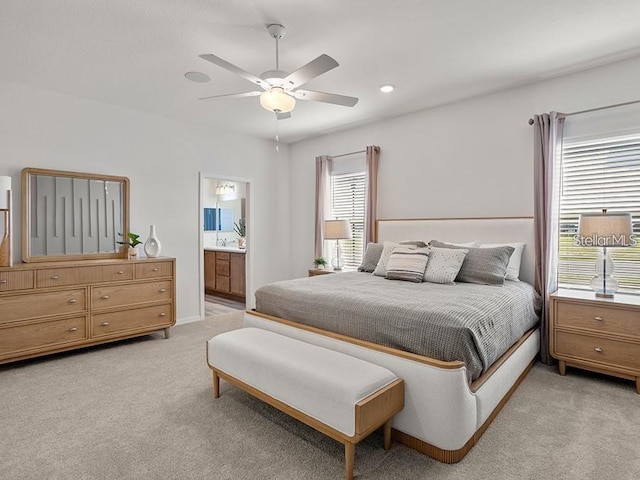 7515 SW 107th Ln, Ocala, FL 34476 - bedroom featuring light carpet, ceiling fan, ensuite bathroom, and recessed lighting