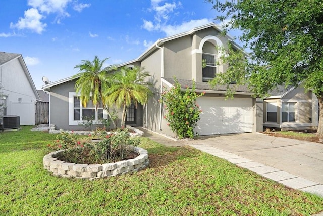 8818 Tottenham Way, Kissimmee, FL 34747 - view of front of house featuring stucco siding, driveway, a front yard, and an attached garage